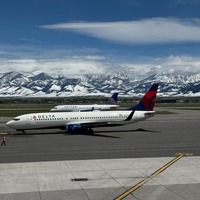 Delta and United Airlines snowy mountains clear sky